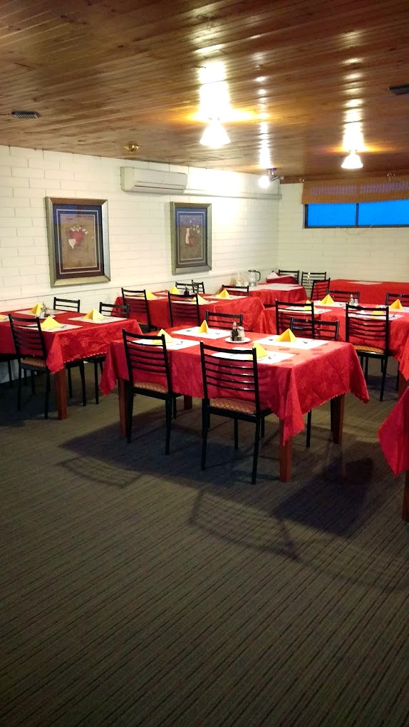 The on-site Chinese restaurant dining room set for dinner